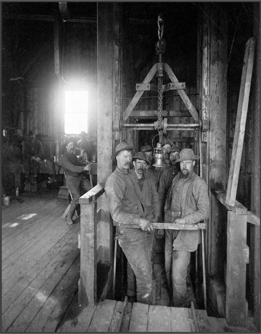 Miners in the cage prepared to be ‘dropped’ into the mine. Miners in the cage prepared to be ‘dropped’ into the mine.