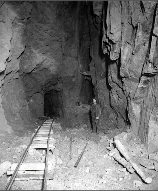 A miner 500 feet below ground in a Cripple Creek district mine. A miner 500 feet below ground in a Cripple Creek district mine.