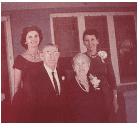 Screenshot 2025-04-04 143708 Edith and Gertrude on front porch with their parents